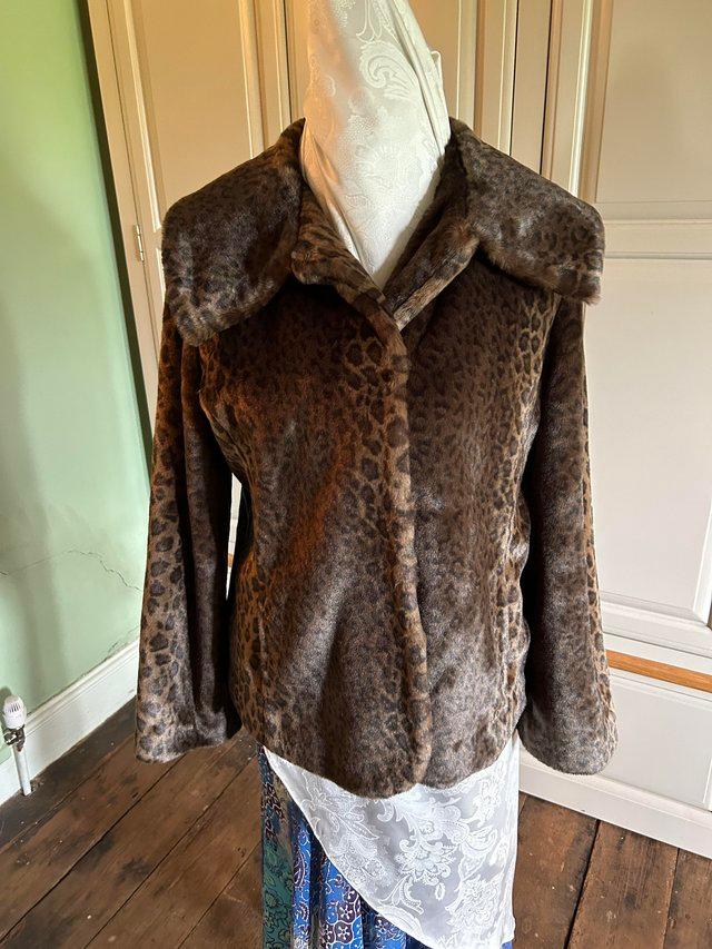 Preview of the first image of Per Una Faux Fur dark leopard fur jacket.