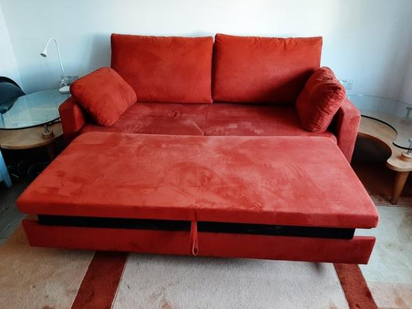 Image 3 of Red sofa with metal feet and pullout bed with storage