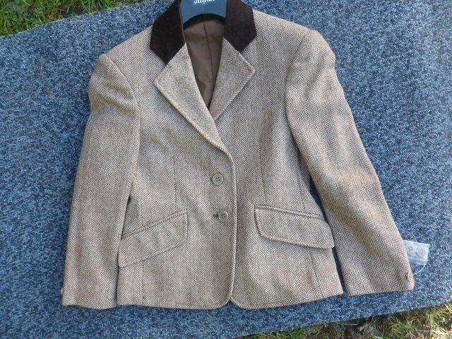 Preview of the first image of New Shires  24" brown herringbone jacket.