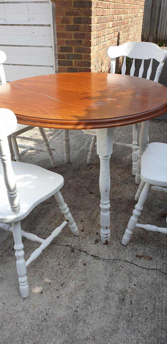 Preview of the first image of Farmhouse style extendable round dining table.