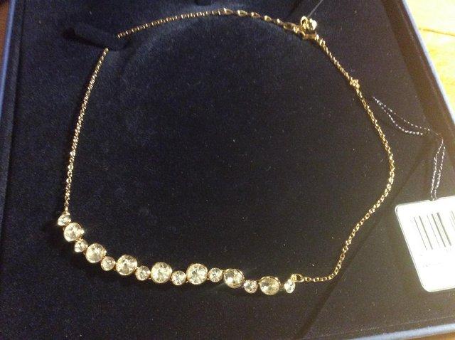 Preview of the first image of Swarovski gold and crystal necklace.