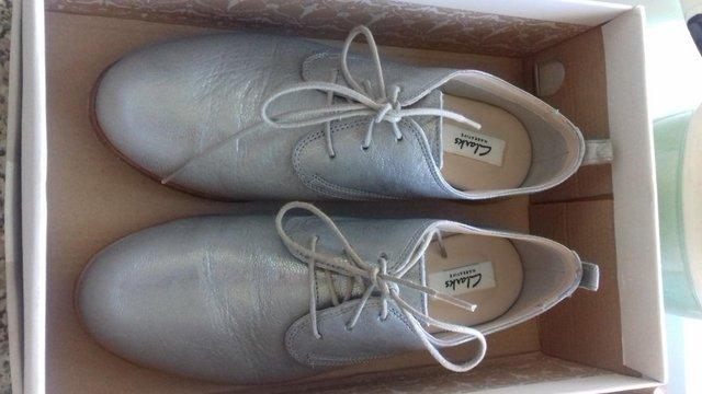 Preview of the first image of Ladies silver lace-up Shoes......