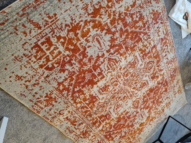 Preview of the first image of Large antique orange floor rug.