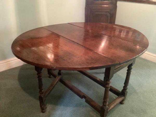 Image 1 of Antique oak gate leg drop leaf oval dining table. VGC