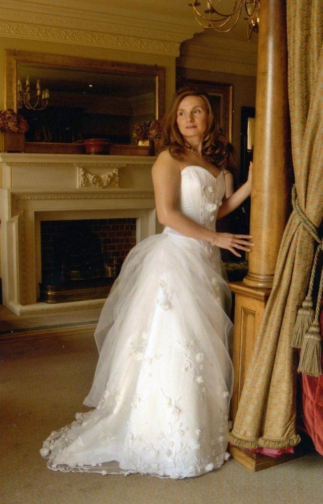 Preview of the first image of Stunning size 8-10 designer wedding dress (Elizabeth Todd).