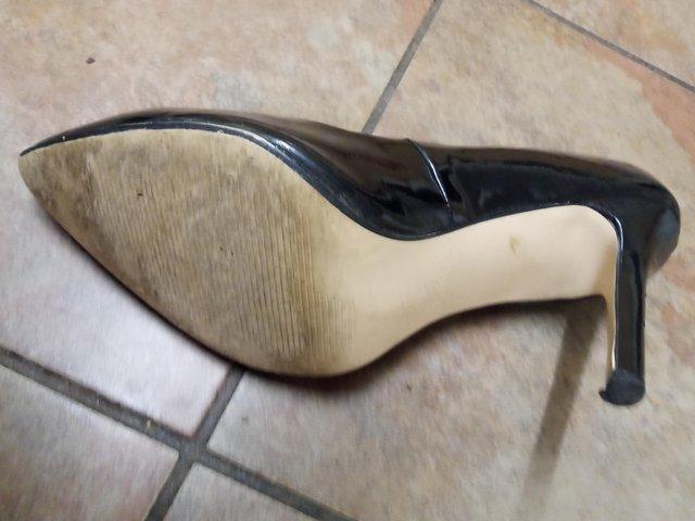 Preview of the first image of Used Black high heels ladies shoes.