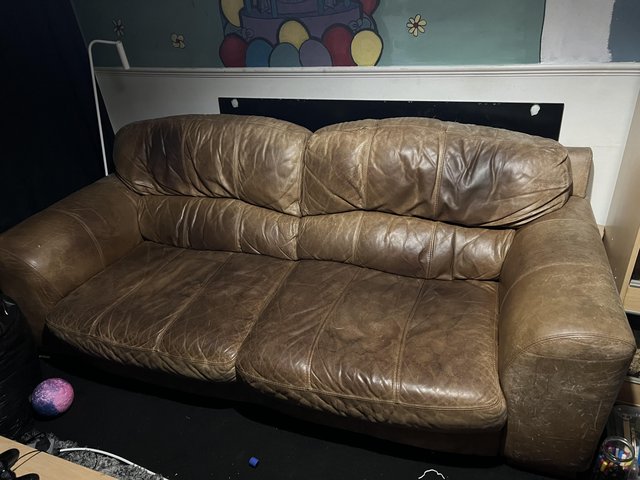 Preview of the first image of Brown leather sofa for free.