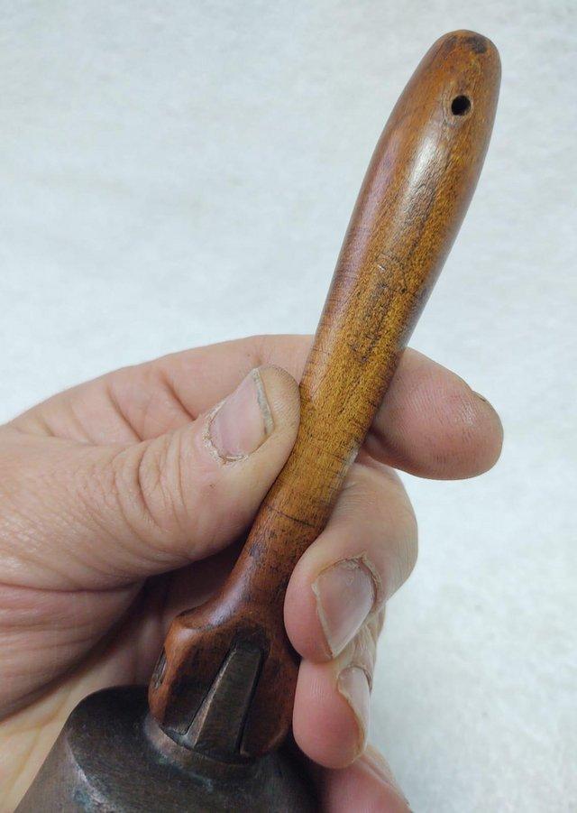 Preview of the first image of A Small Brass Or Bronze Bell With Hardwood Handle.