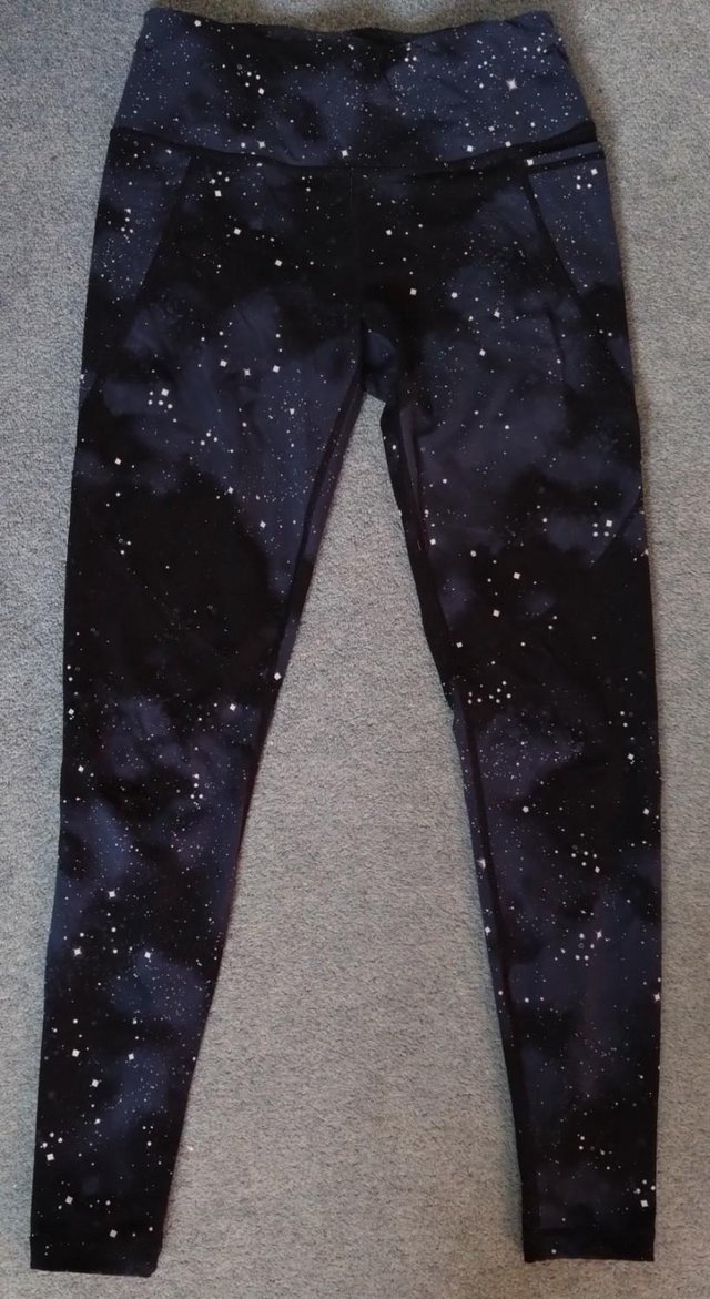 Preview of the first image of Sweaty Betty Black Ditsy Star Print Power Gym Leggings size.