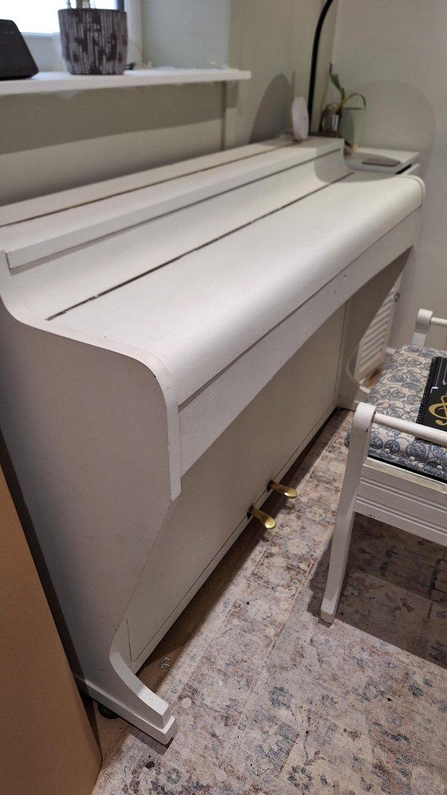 Preview of the first image of White painted Piano with stool.