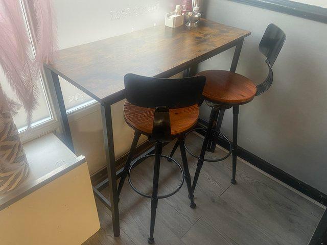 Preview of the first image of Breakfast bar table & stools x2 sets available.