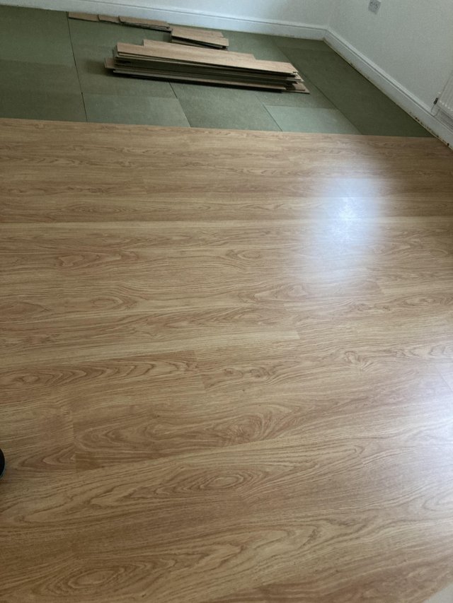 Preview of the first image of Golden oak effect laminate flooring.