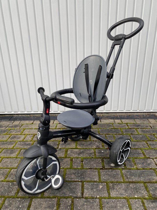 Preview of the first image of Smyths Toys Black toddlers tricycle with adult push bar.