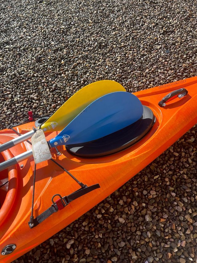 Preview of the first image of Riot Kayak with two paddles.
