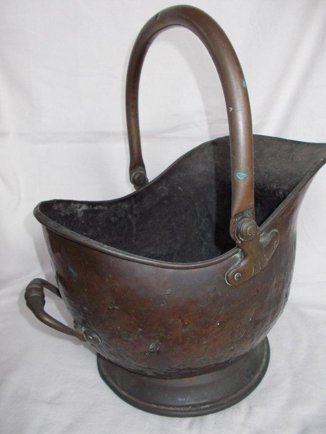 Preview of the first image of Old copper Sailsbury coal bucket scuttle, nice original pati.