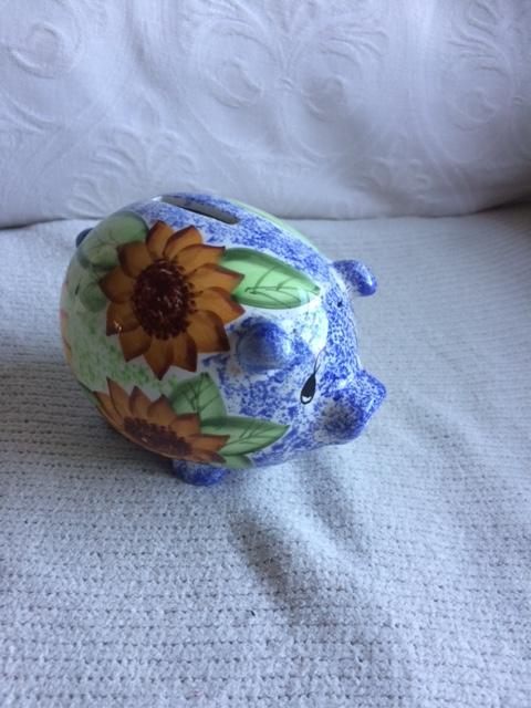 Preview of the first image of Lovely Ceramic Piggy Bank with flowers on it.