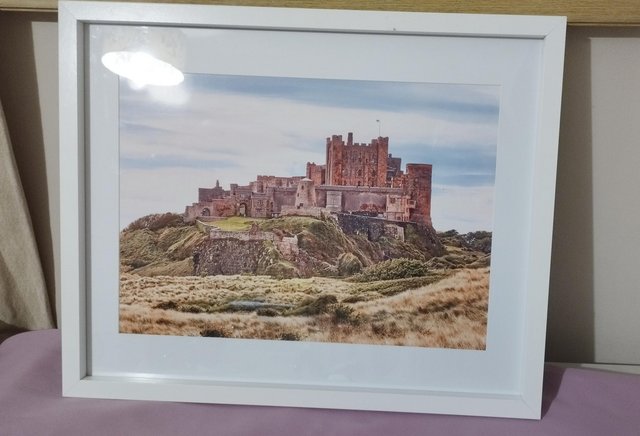 Preview of the first image of Bamburgh castle framed photo print.
