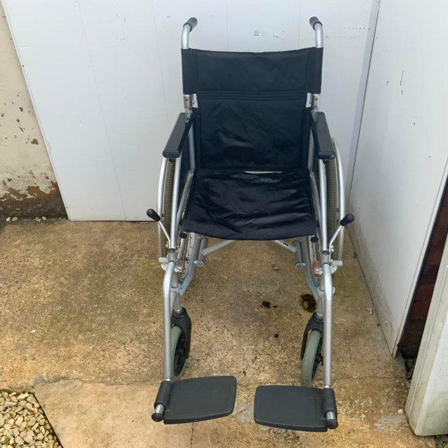 Preview of the first image of Light weight wheelchair ideal push or drive oneself.