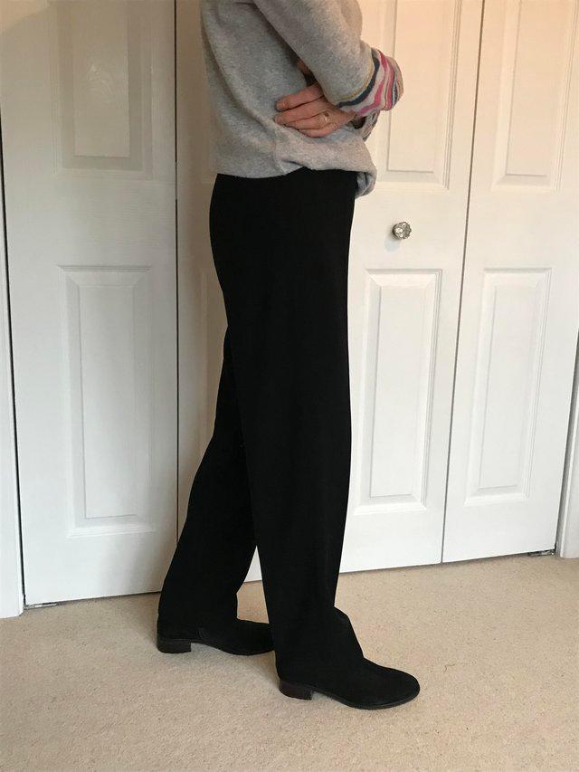 Preview of the first image of Ladies Kaliko black crepe straighttrousers size 8.