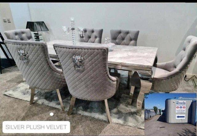 Preview of the first image of Louis marble dining table with 4 rose silver plush chairs.