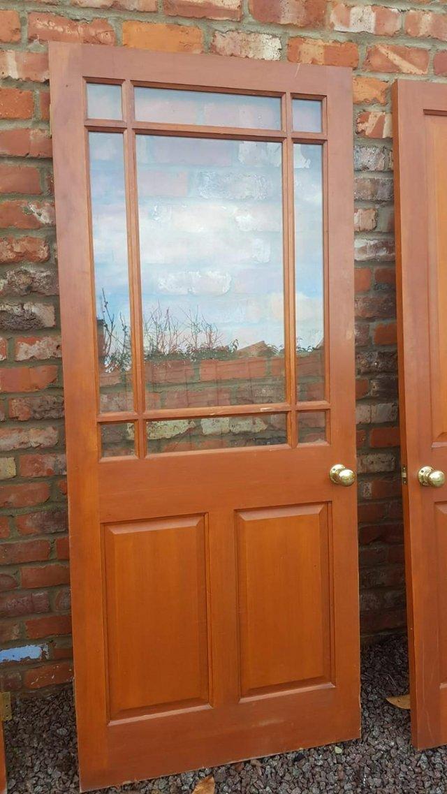 Preview of the first image of Solid Wood Door with Brass Knob with Top Half Lattice Window.