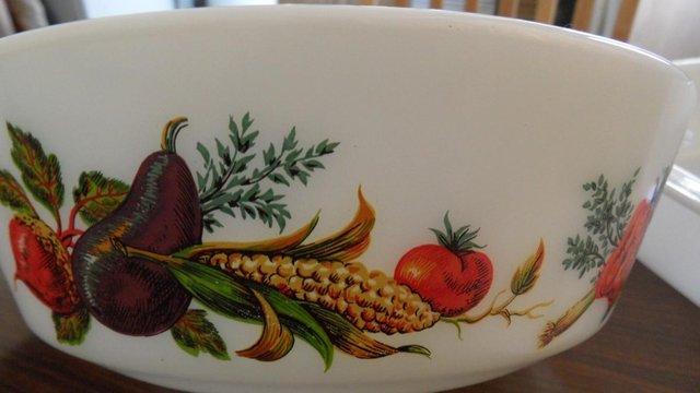 Preview of the first image of Two White Pyrex Casserole Dishes with Vegetable Pattern.