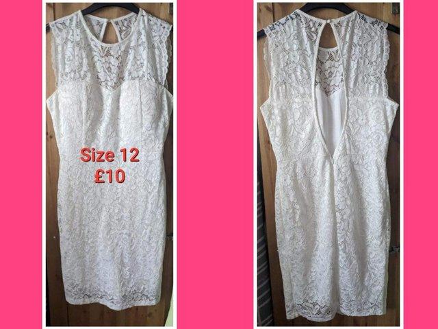 Preview of the first image of WHITE lace dress - size 12 with zip.