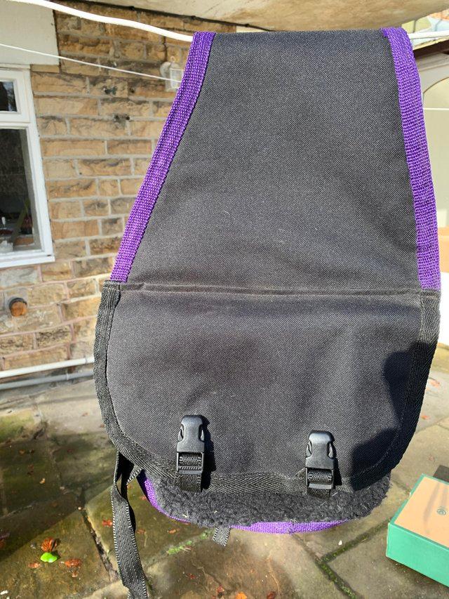 Preview of the first image of Riding pannier purple & black light weight sheepskin back.