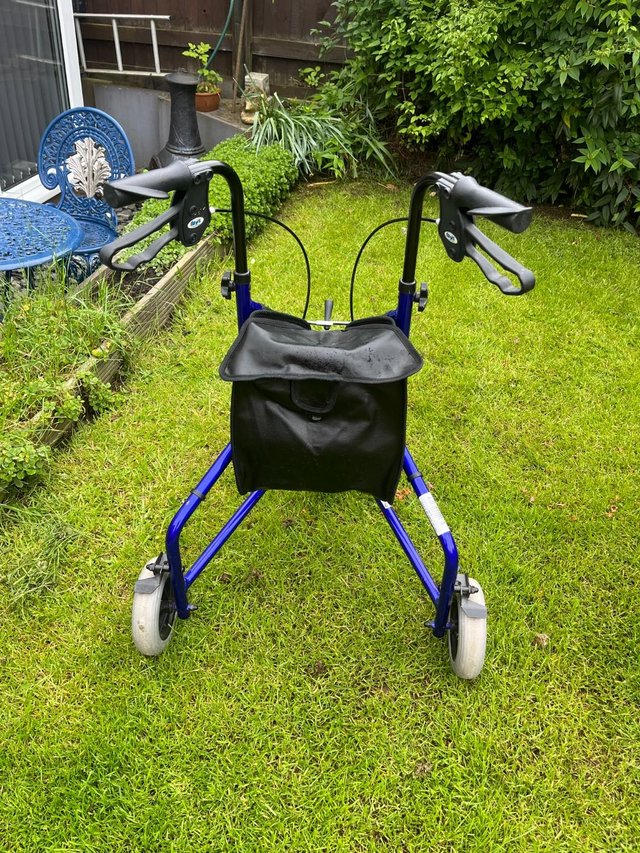 Preview of the first image of Three wheel walking aid with triangle shaped bag.