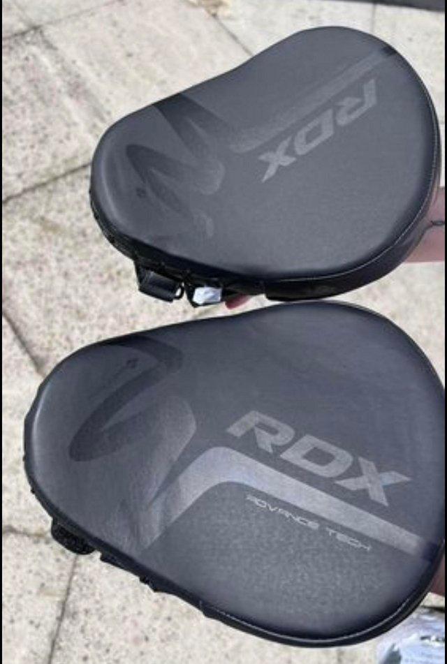 Preview of the first image of RDX F15 Noir Boxing Gloves and Pads.