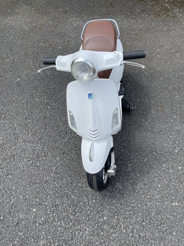 Preview of the first image of Child vespa style electric scooter.