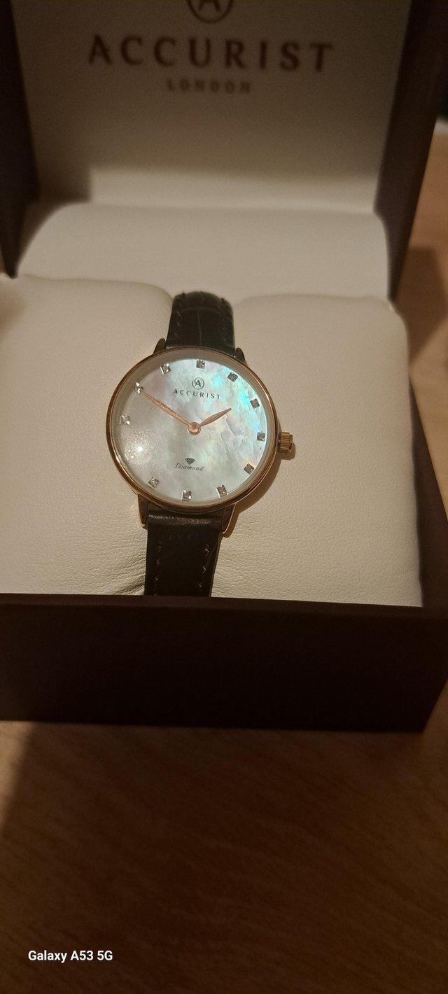Preview of the first image of Ladies rose plated watch with diamonds.