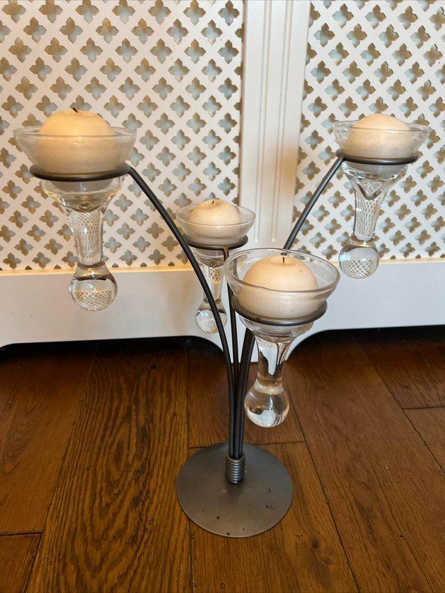 Preview of the first image of Candle holder with 4 glass shaped holders.