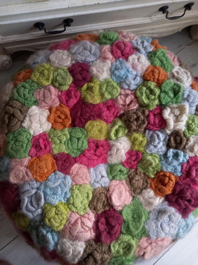 Preview of the first image of Marks & spencers m&s crochet flowers pouffe used RRP £145.