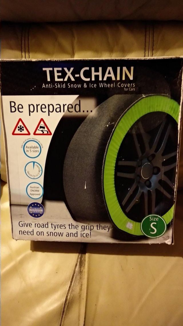 Preview of the first image of SNOW SOCKS ANTI SKID SNOW & ICE WHEEL COVERS.