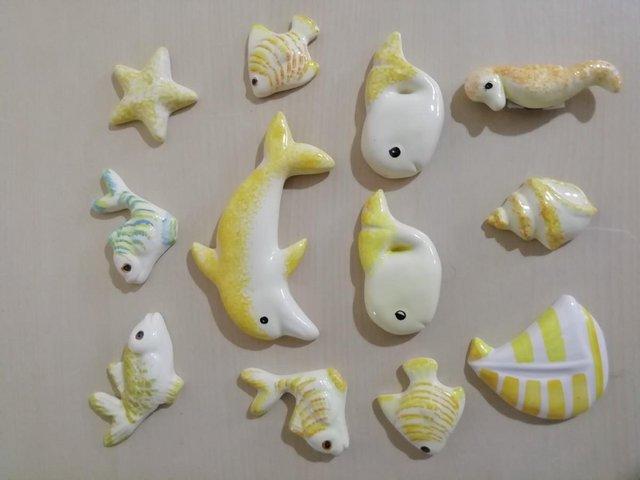 Preview of the first image of Ceramic Fish & seaside objects - wall art.
