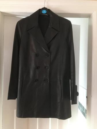 Image 1 of A Marks & Spencer ladies soft black leather coat.