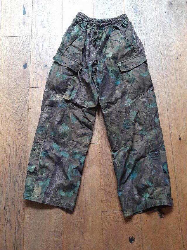 Preview of the first image of Camouflage Waterproof Trousers and Coat by Jack Pyke.