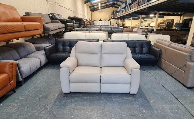 Preview of the first image of Parma/Strauss cream leather electric recliner 2 seater sofa.