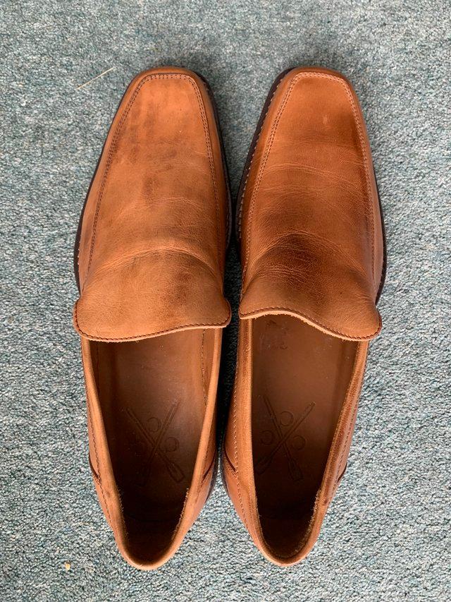 Preview of the first image of Crewe Harbard tan leather slip on shoes size 43.