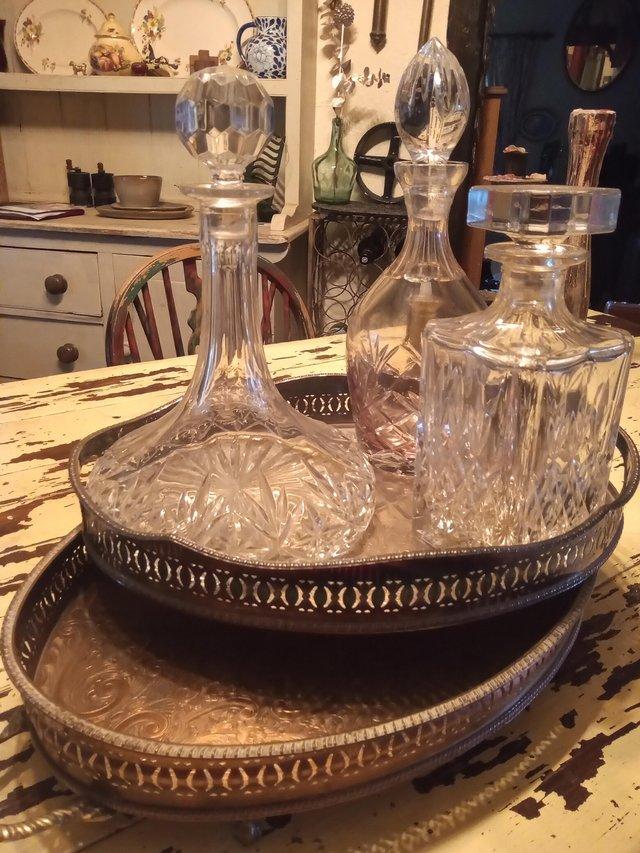 Preview of the first image of Three lead crystal Decanters and gallery trays.