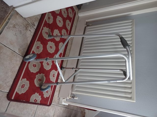 Preview of the first image of New walking frame with 2 wheels, excellent condition.
