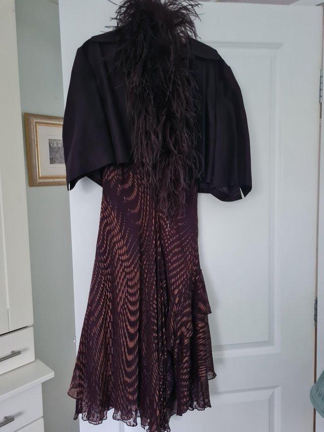Preview of the first image of Fenn Wright Manson aubergine wedding guest outfit.