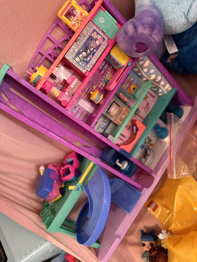 Preview of the first image of Polly pocket bundle including shopping mall.