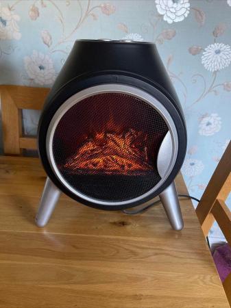 Image 1 of Round black Electric fan heater With log effect