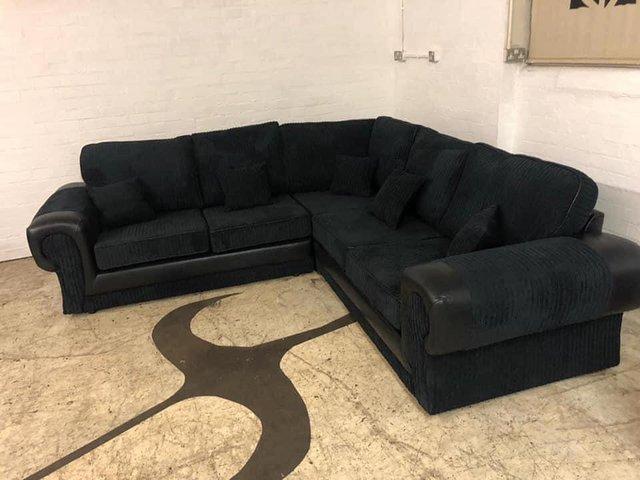Preview of the first image of Tango 2 corner 2 sofa in black and black jumbo cord.