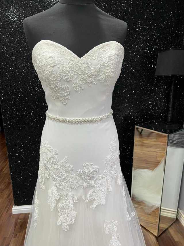 Preview of the first image of New Beautiful by Enzoani Wedding Dress.