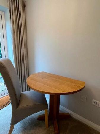 Image 1 of Round Oak drop leaf table and chair