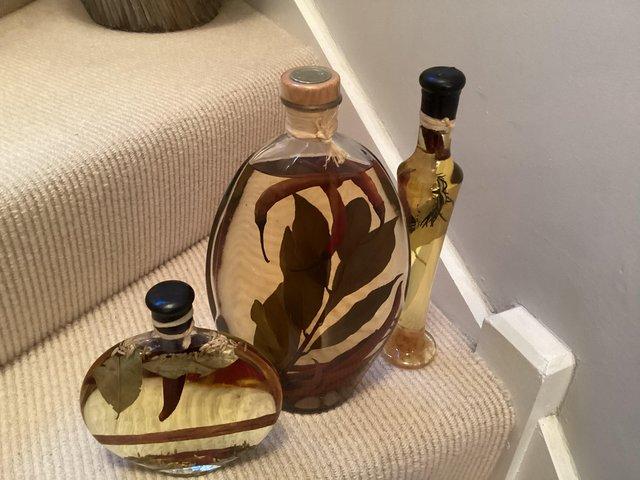 Preview of the first image of Decorative infused filled bottles.