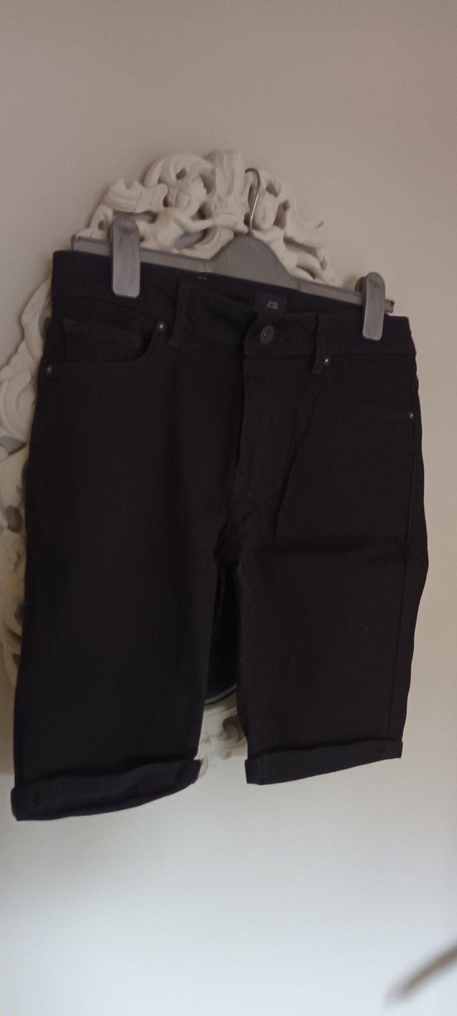 Preview of the first image of River Island mens black shorts.